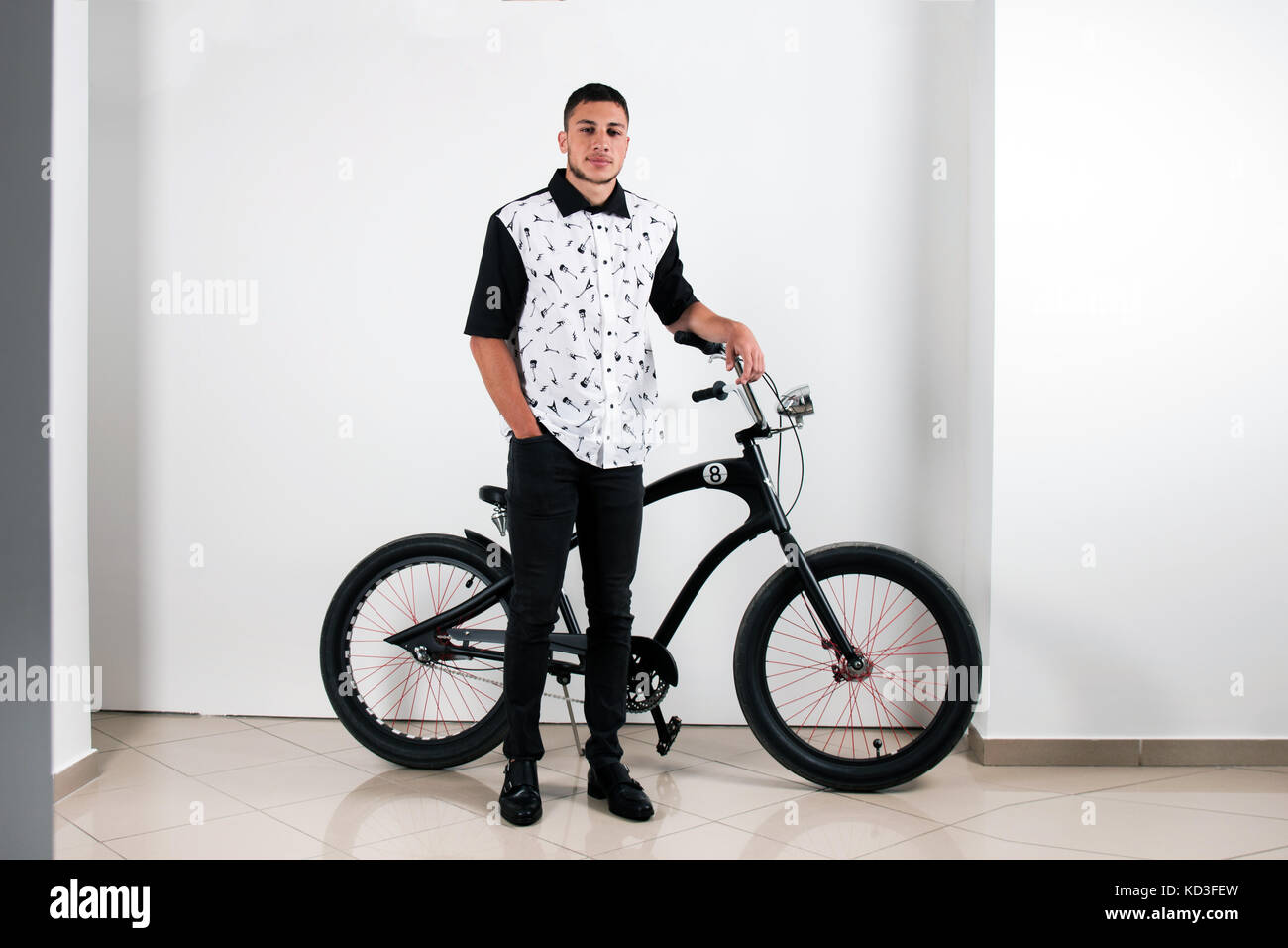 Teenager Posing With A Vintage Style Retro Clothing And Bike Teenager Posing With A Vintage Style Retro Clothing And Bike