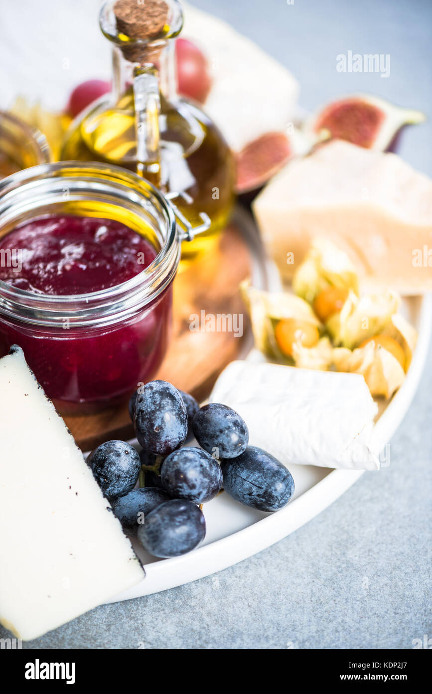 Cheese Board With Cranberry And Autumn Fruits Decorated With