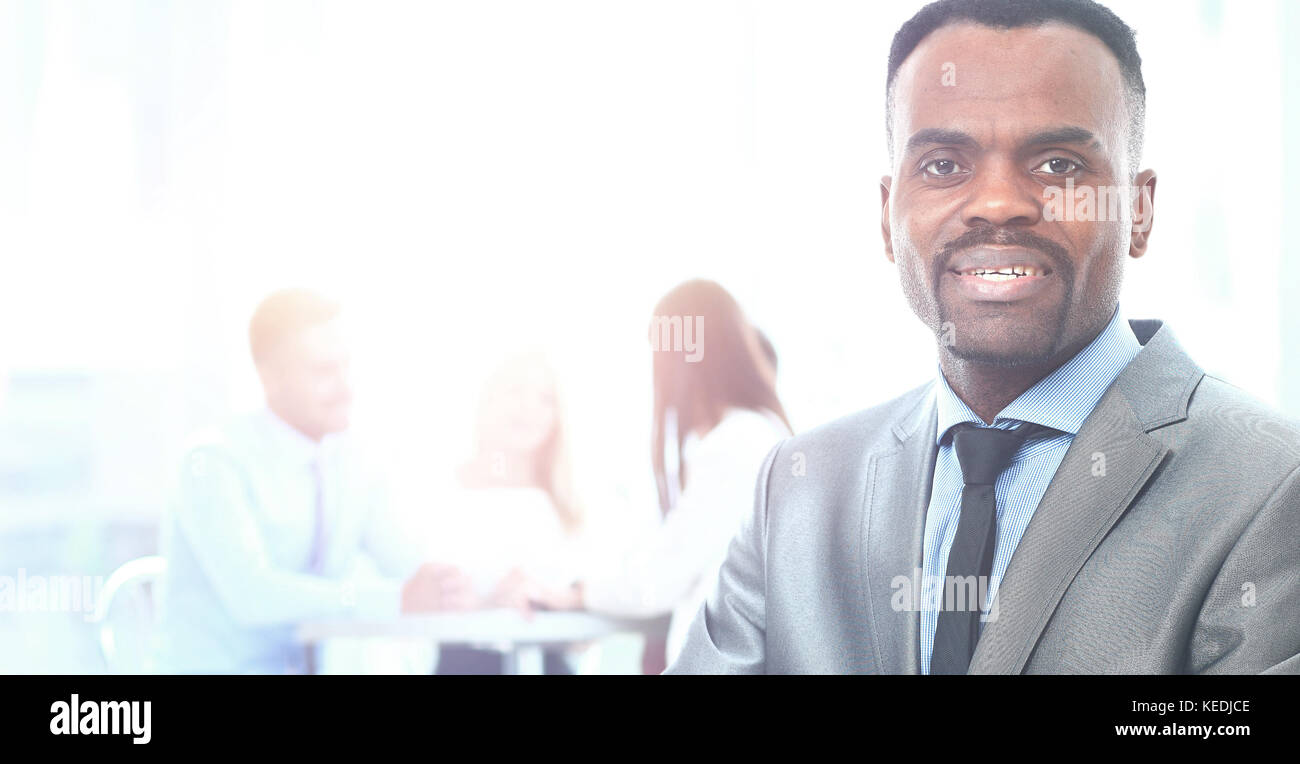 Portrait Of Smiling African American Business Man With Executives