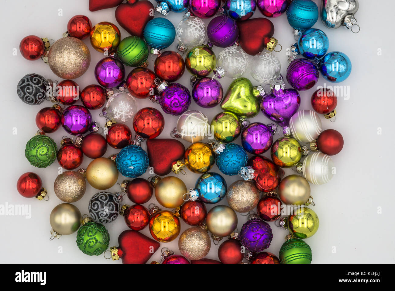 Christmas Background Theme Multicolored Christmas Balls Red Blue Green Silver Gold Purple Yellow On A White Background Christmas Background Theme Multicolored Christmas Balls Red Blue Green Silver Gold Purple Yellow On A White Background