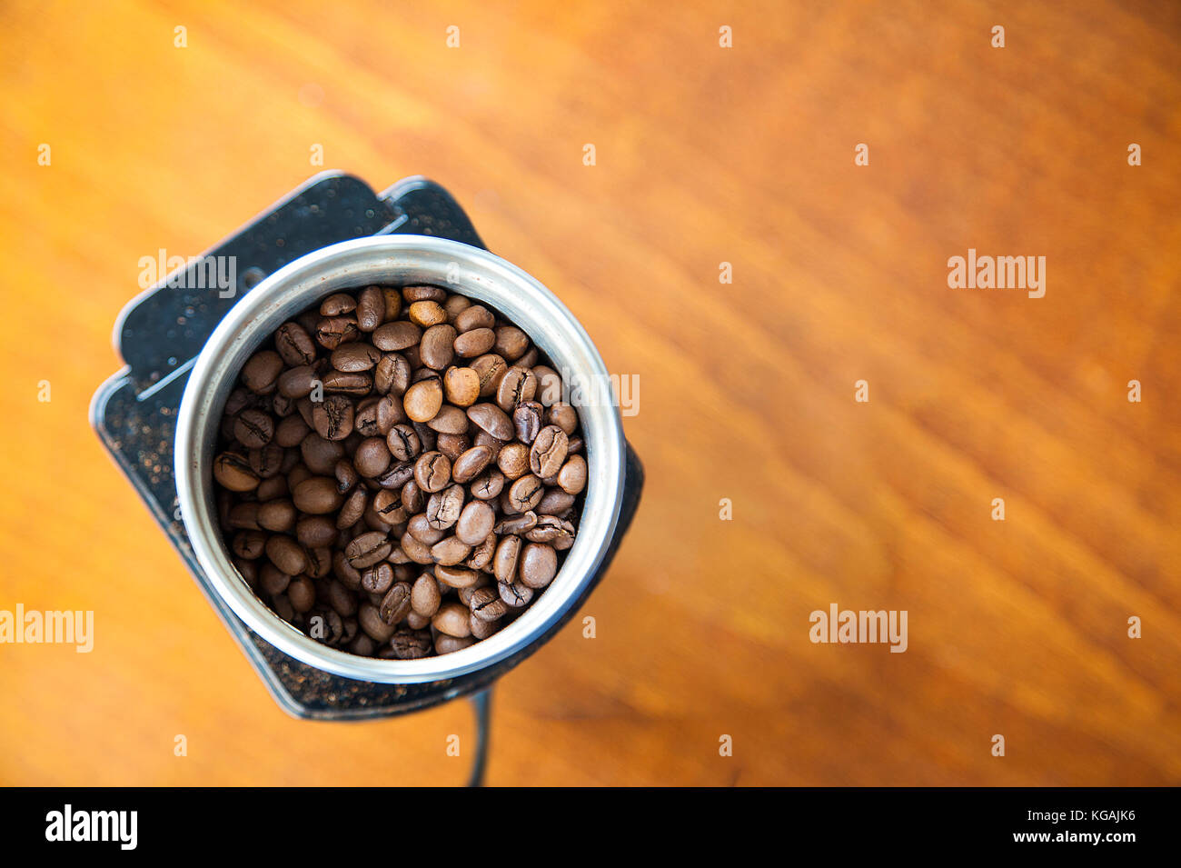 Mocha Coffee Beans Poured Onto An Electric Grinder Ready For Grinding With Copy Space Top View Mocha Coffee Beans Poured Onto An Electric Grinder Ready For Grinding With Copy Space Top View
