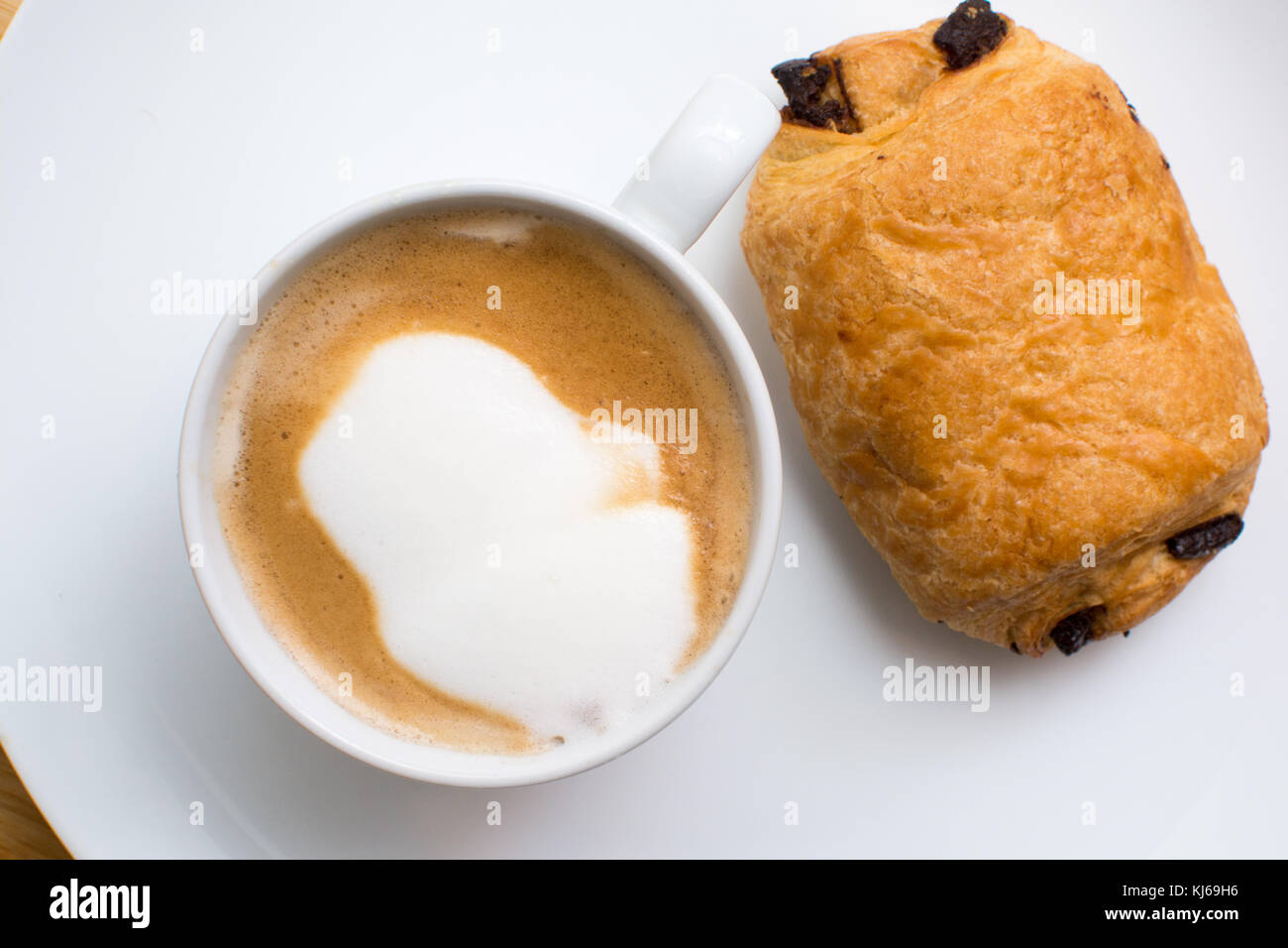 Breakfast Food On A Plate Cappuccino Coffee And Chocolate Croissant Breakfast Food On A Plate Cappuccino Coffee And Chocolate Croissant