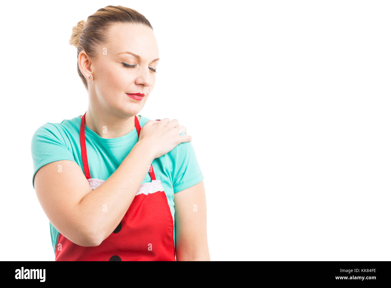 woman with red apron grabbing painful shoulder after home cleaning home cleaning job