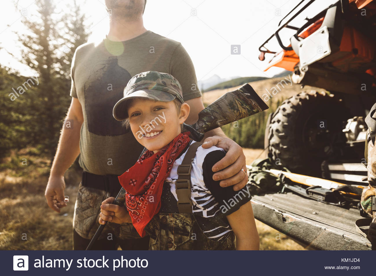 Portrait Smiling Father And Son Hunter Preparing For Hunting Stock