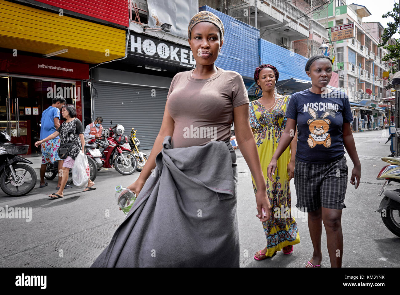 African Women walking along the street in Pattaya Thailand Stock Photo