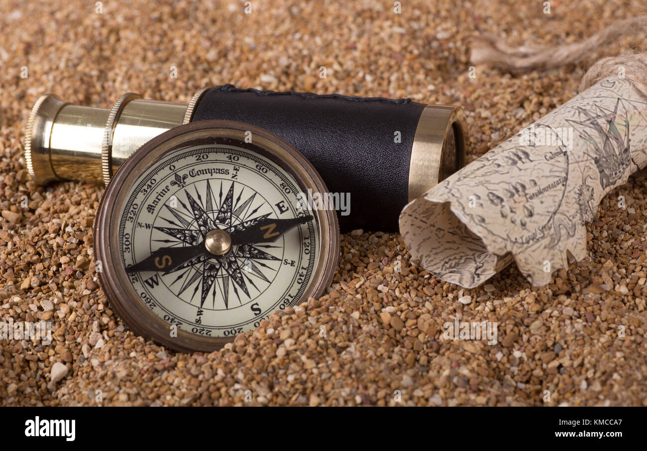 brass-compass-and-telescope-with-a-treas
