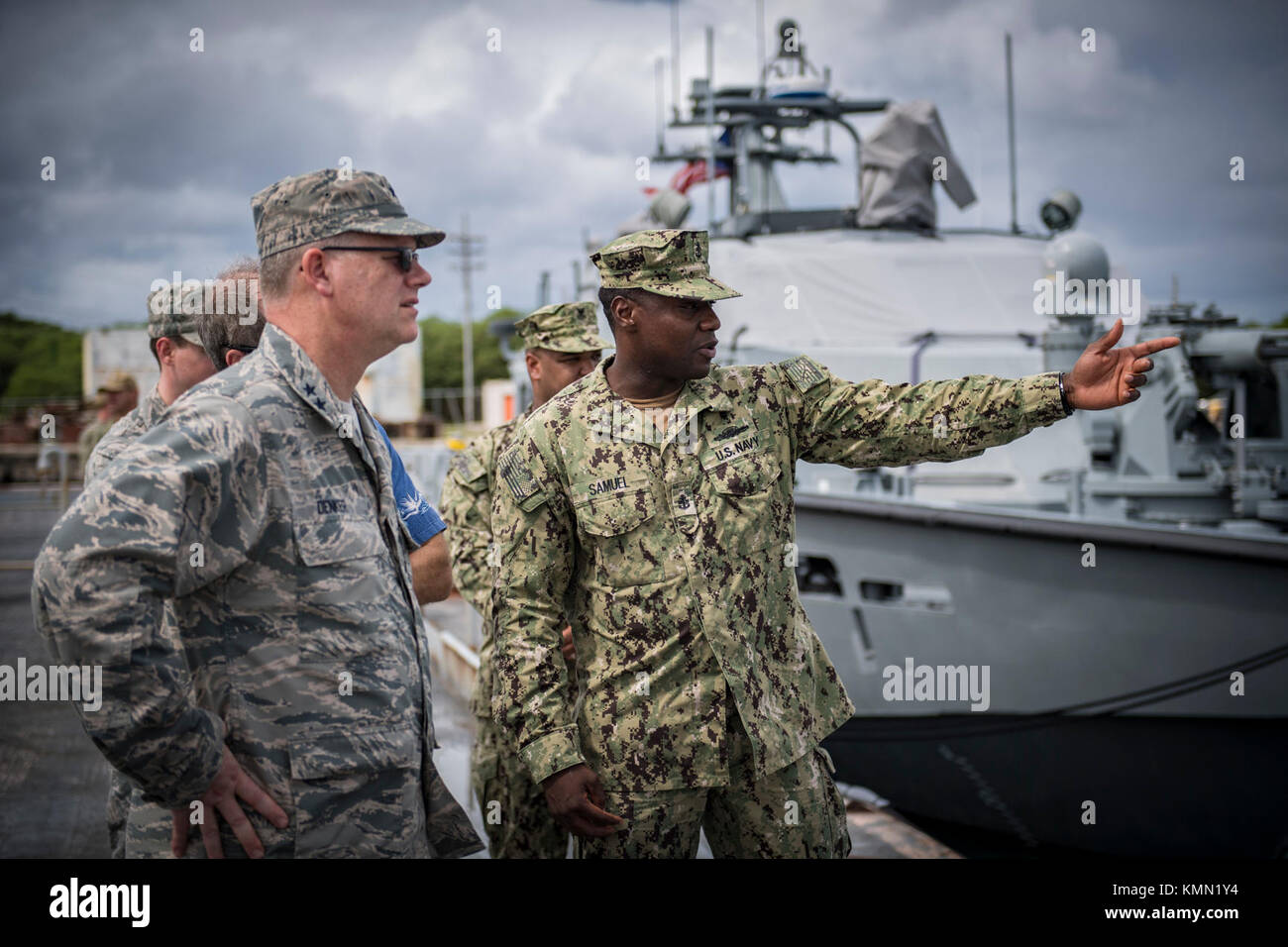 U.S. Navy Chief Electronics Technician Kenan Samuel, right, assigned