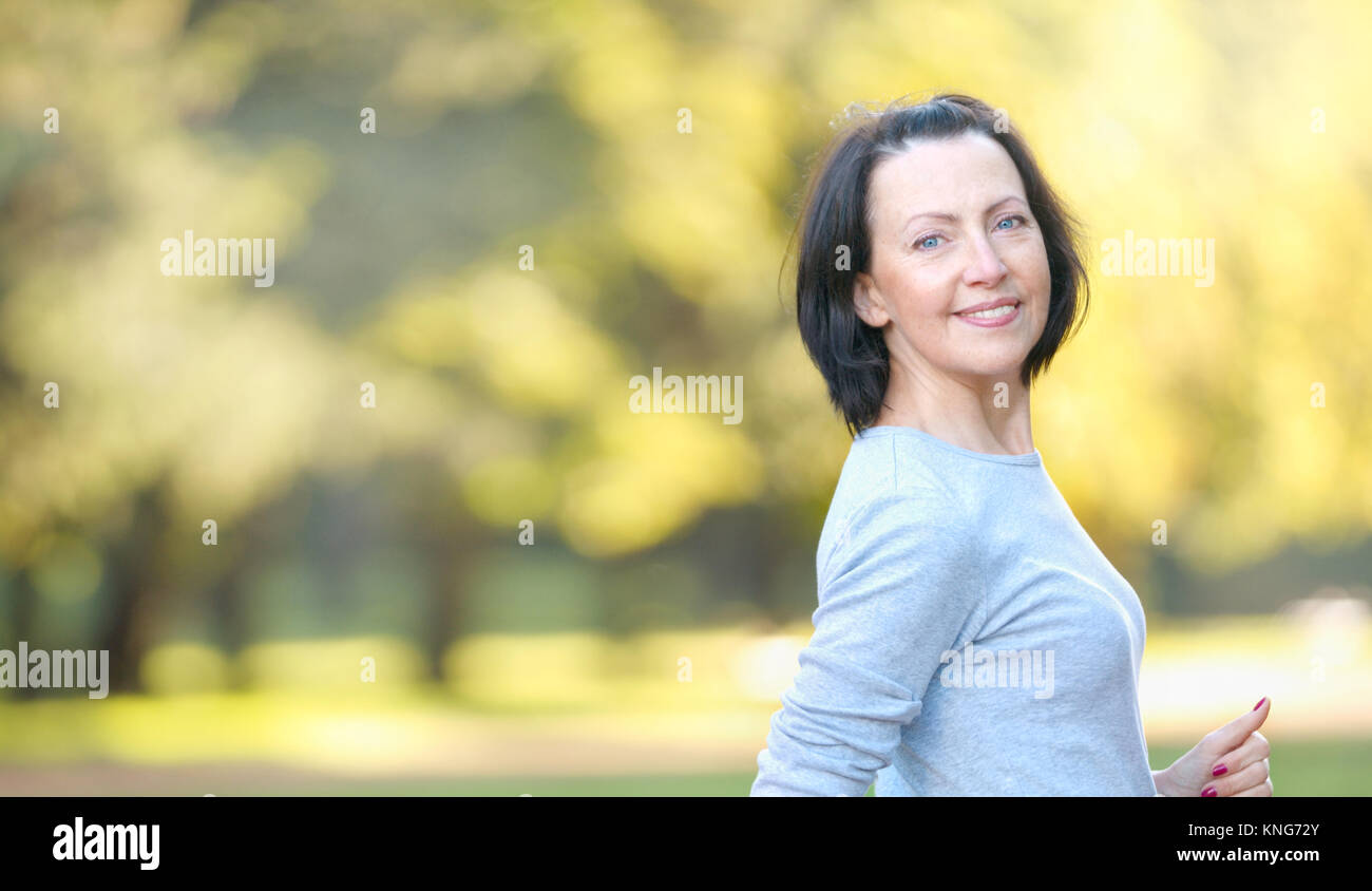 Portrait Of Mature Woman Weared In Sports Clothes In The Park