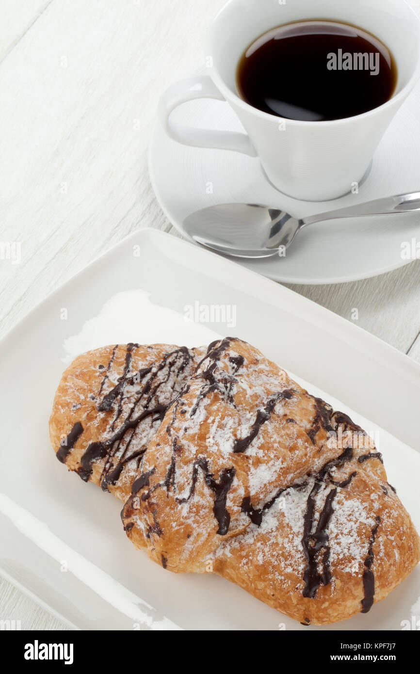 Chocolate Croissants On Plate With Cup Of Coffee Chocolate Croissants On Plate With Cup Of Coffee