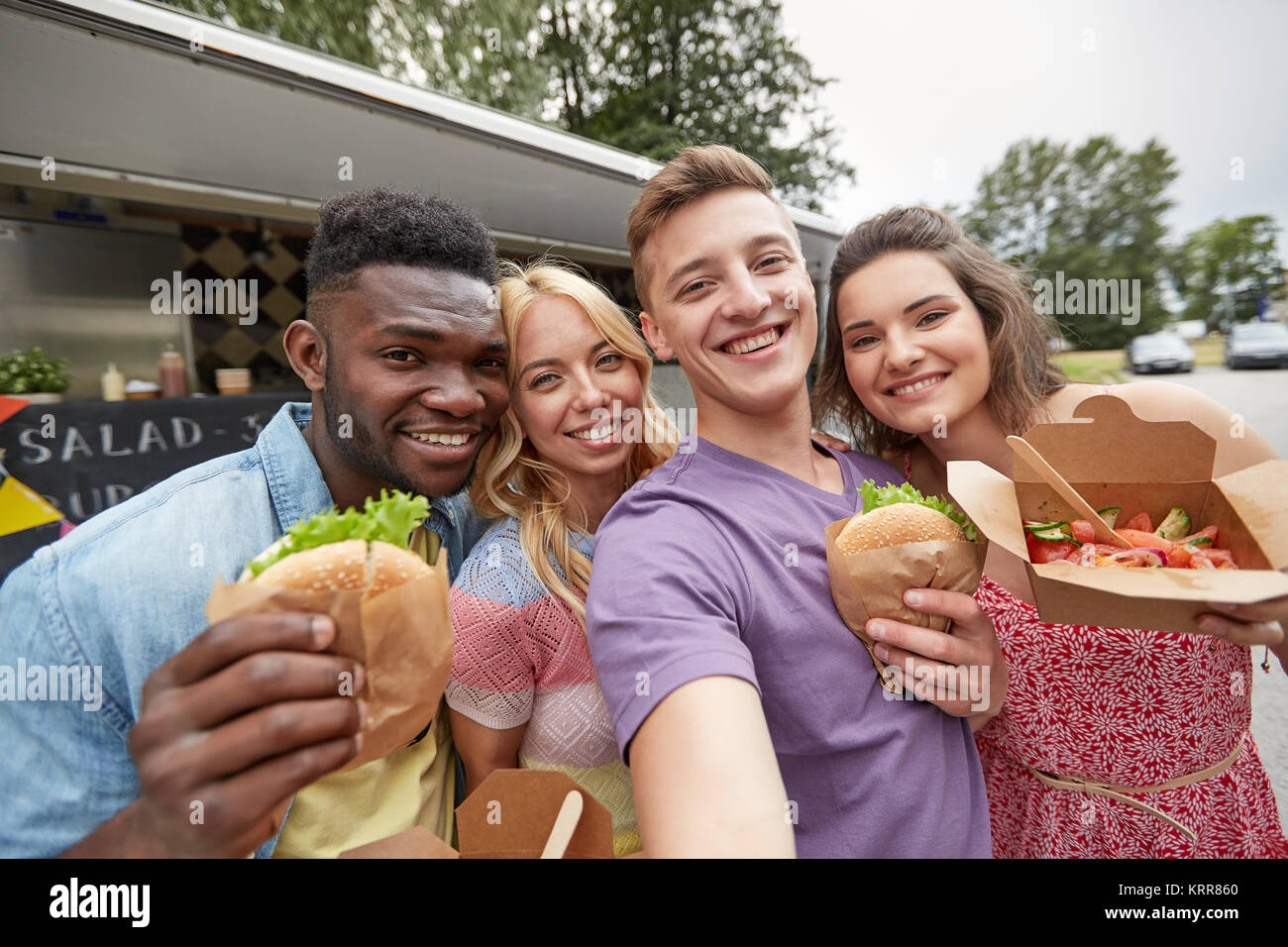 Happy Friends Taking Selfie At Food Truck Stock Photo Alamy