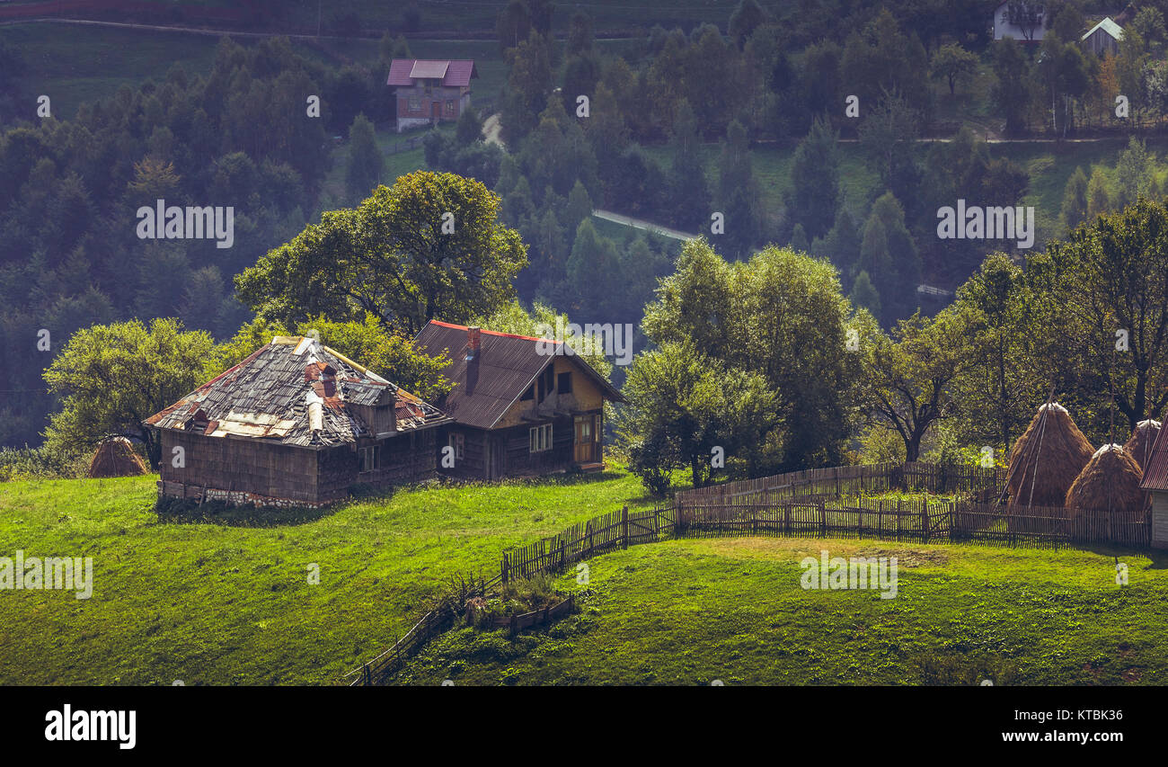 Picturesque rural scenery with remote old traditional Romanian wooden