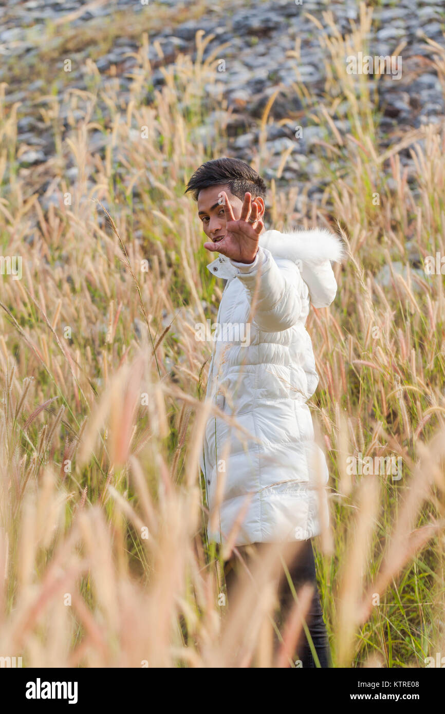 A Gay Wear Winter Clothes Walking In A Flowering Meadow In Winter The Weather Getting Cool