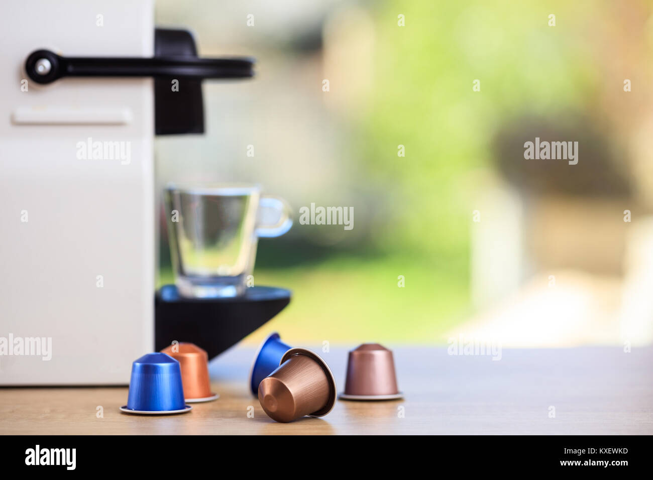 Espresso Capsules On Blur Espresso Maker Background Closeup View