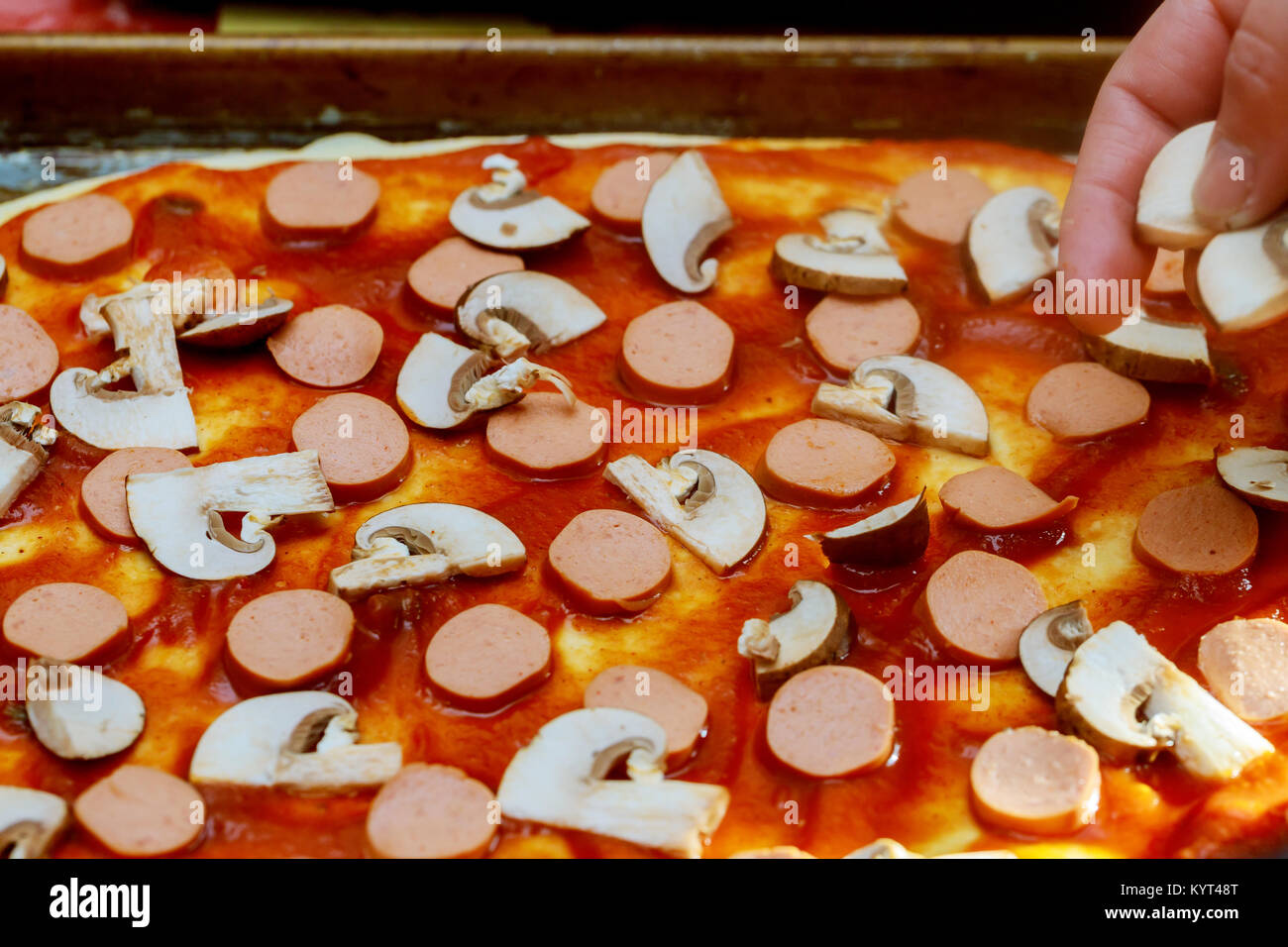 Make Pizza Cooking Cook In The Kitchen Putting Ingredients On Make Pizza Cooking Cook In The Kitchen Putting Ingredients On