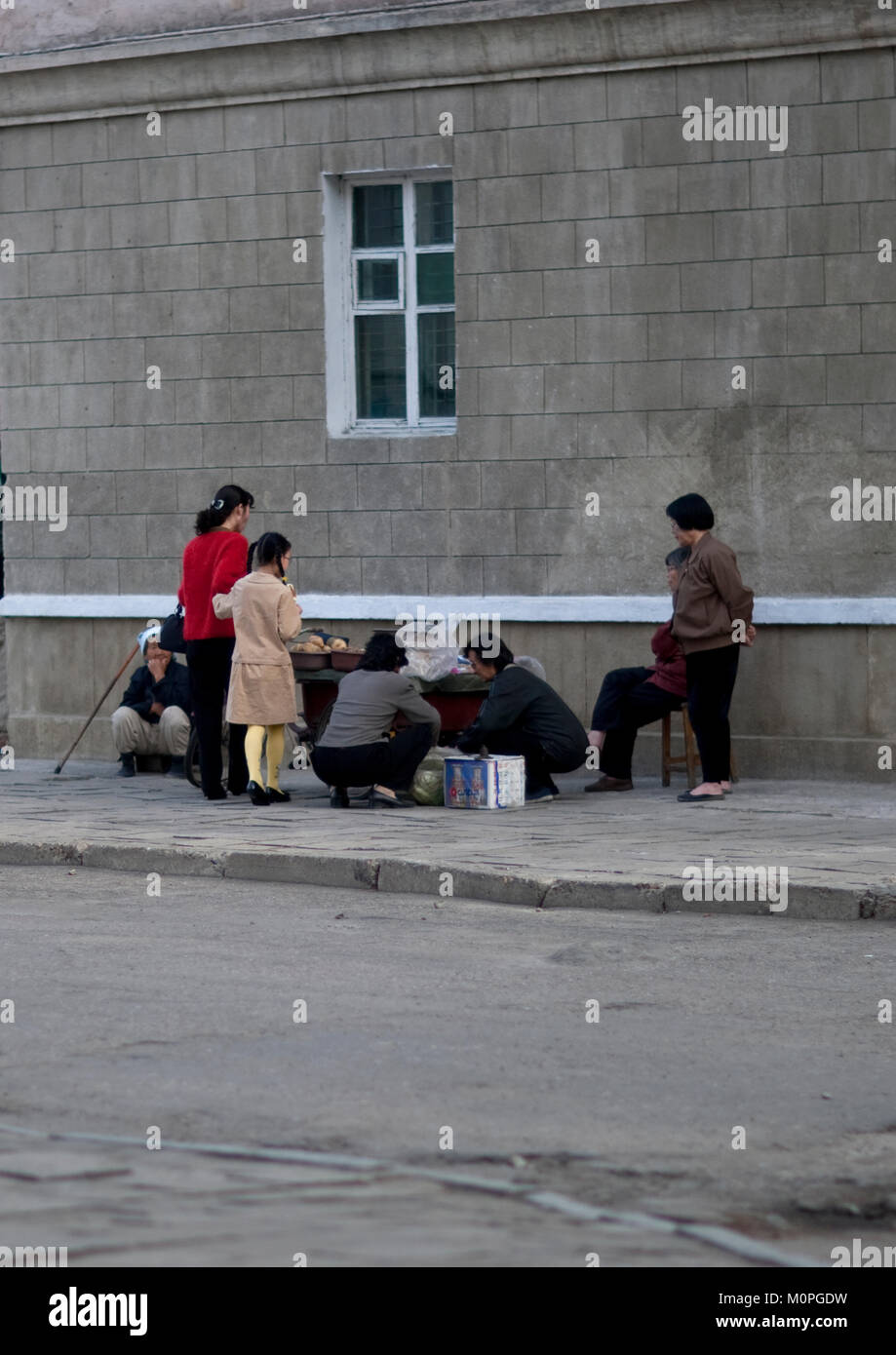 North Korean People Buying Food To Street Seller Pyongan Province Pyongyang North Korea North Korean People Buying Food To Street Seller Pyongan Province Pyongyang North Korea