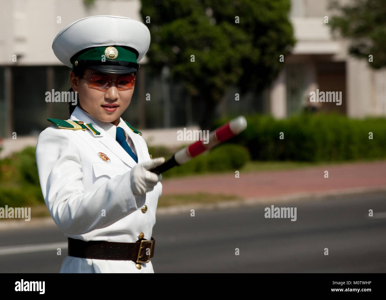 North Korean Female Traffic Security Officer In White Uniform In The