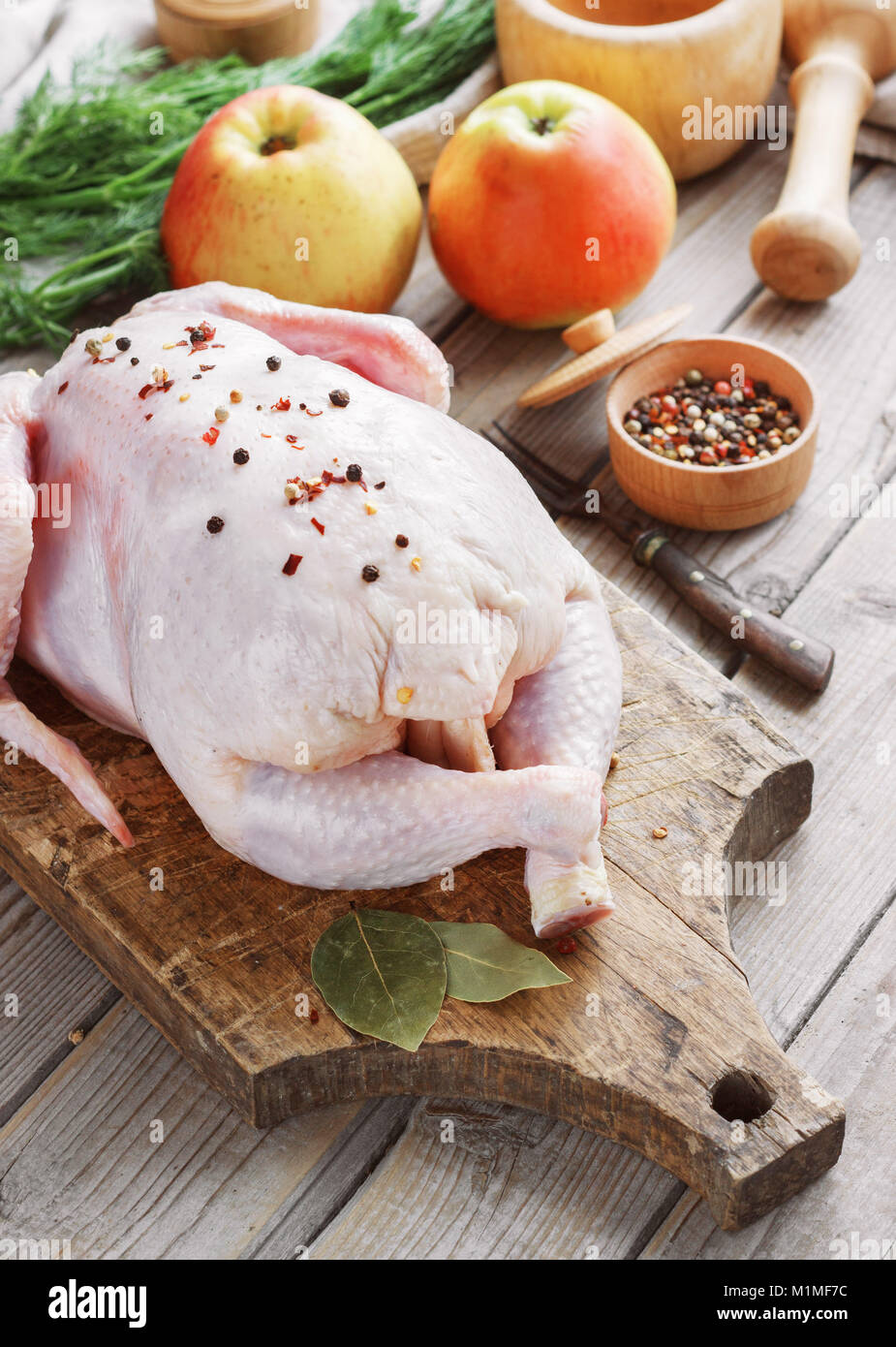 Chicken Carcass On A Wooden Background With Spices And Apples Cooking In The Kitchen Chicken Carcass On A Wooden Background With Spices And Apples Cooking In The Kitchen
