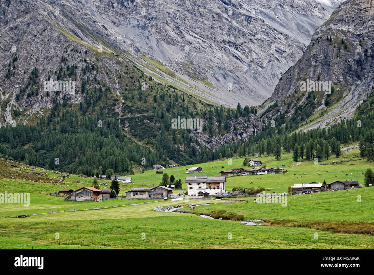 Remote Alpine Community Sited On Meadowland Below A Glacial Hanging Valley Remote Alpine Community Sited On Meadowland Below A Glacial Hanging Valley