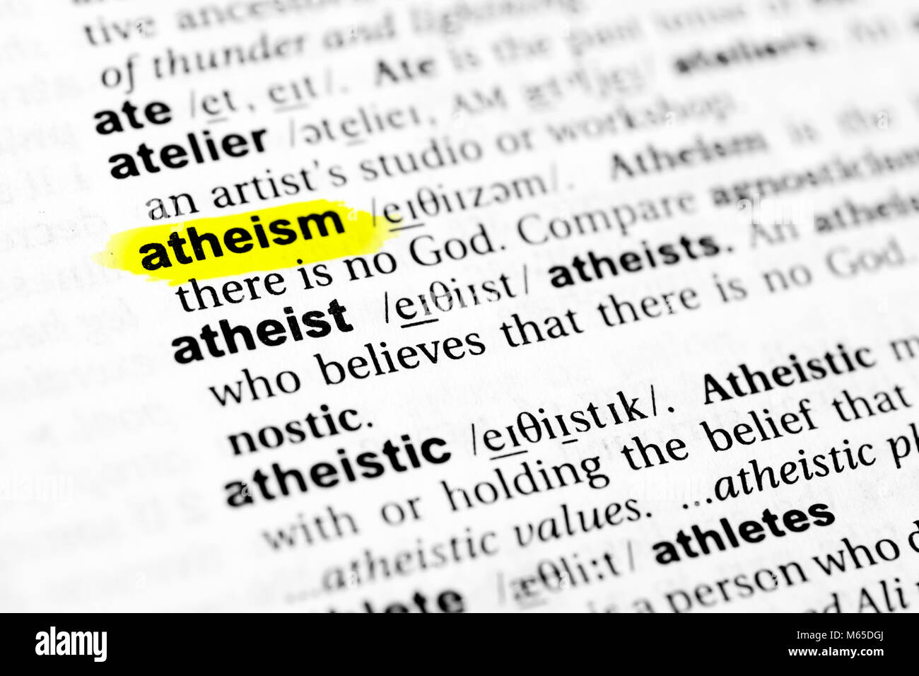 highlighted english word "atheism" and its definition in the stock