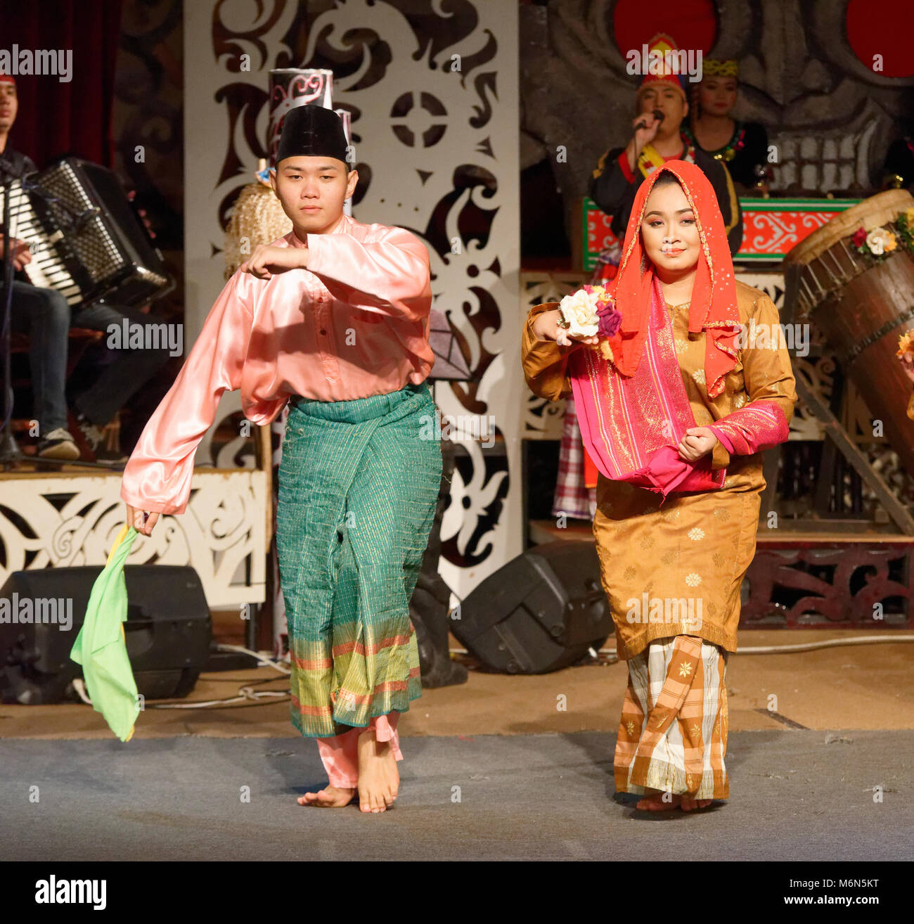 Dancers In Traditional Native Costumes At The Sarawak Cultural Village