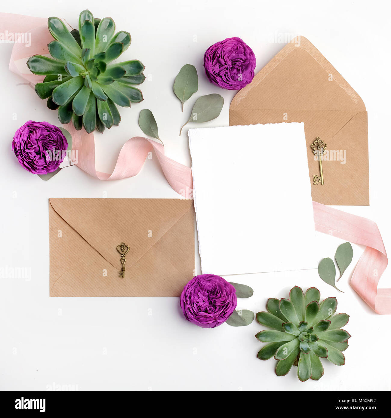 Flat Lay Shot Of Letter And Eco Paper Envelope On White Background