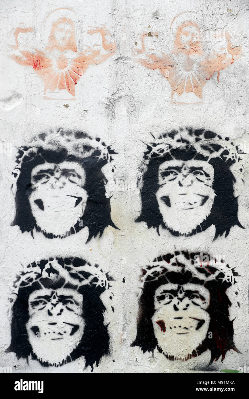 Stenciled Image Of Jesus Christ And Monkeys Wearing A Crown Thorns On Wall Caricature Hanoi Vietnam