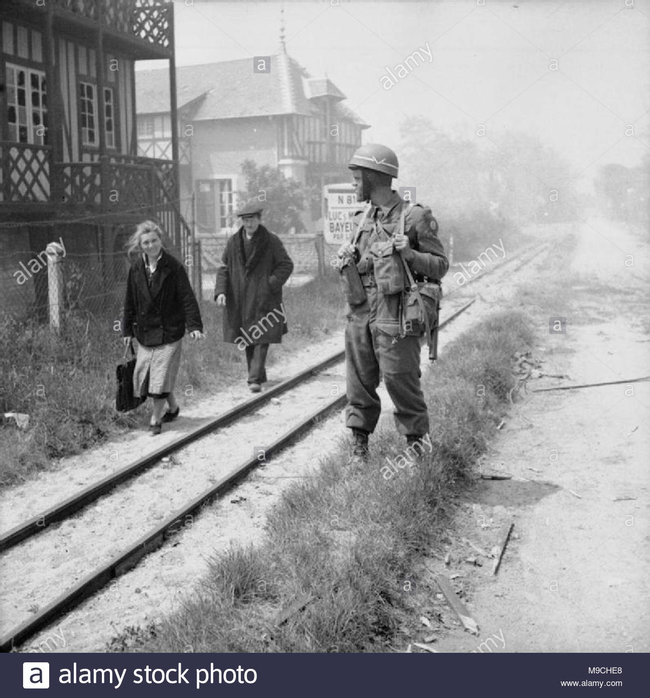 The British Army In Normandy 1944 French Civilians Pa British Military Policeman By A Narrow Gauge Railway Line In La Breche The British Army In Normandy 1944 French Civilians Pa British Military Policeman By A Narrow Gauge Railway Line In La Breche