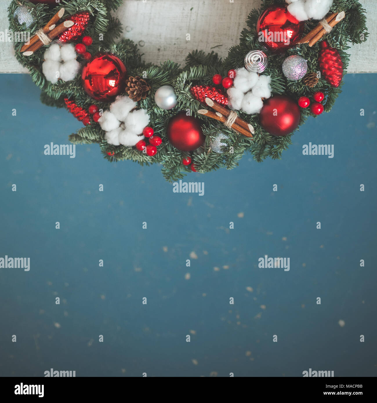christmas background with green xmas tree twig red glass balls and new year decorations on blue background - Teal And Red Christmas Decorations christmas background with green xmas tree twig red glass balls and new year decorations on blue background - Teal And Red Christmas Decorations