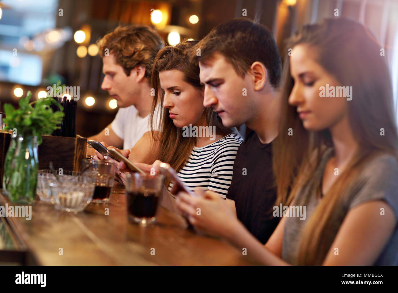 Group Of Friends Enjoying Meal In Restaurant Stock Photo Alamy