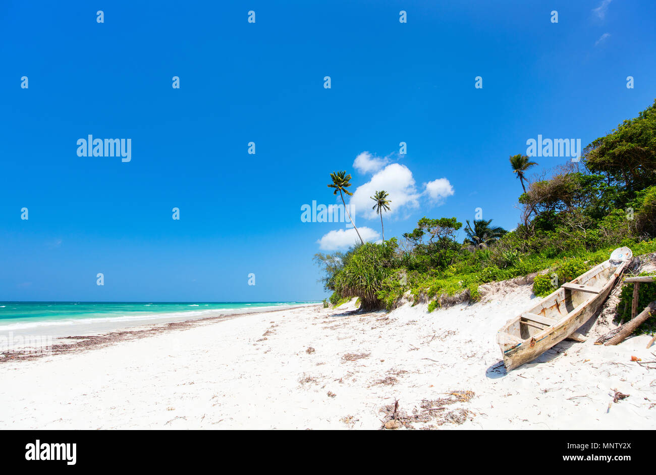 Idyllic Tropical Beach With White Sand Turquoise Ocean Water And Blue