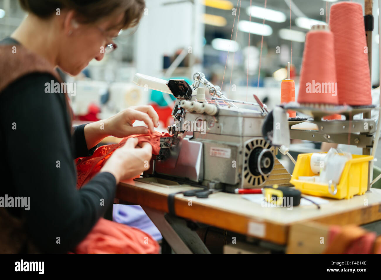 Woman Working In Textile Factory High Resolution Stock Photography And