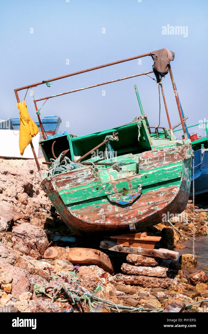 Old Fishing Boat The Old Fishing Boat Stranded On The Rocky Coast In