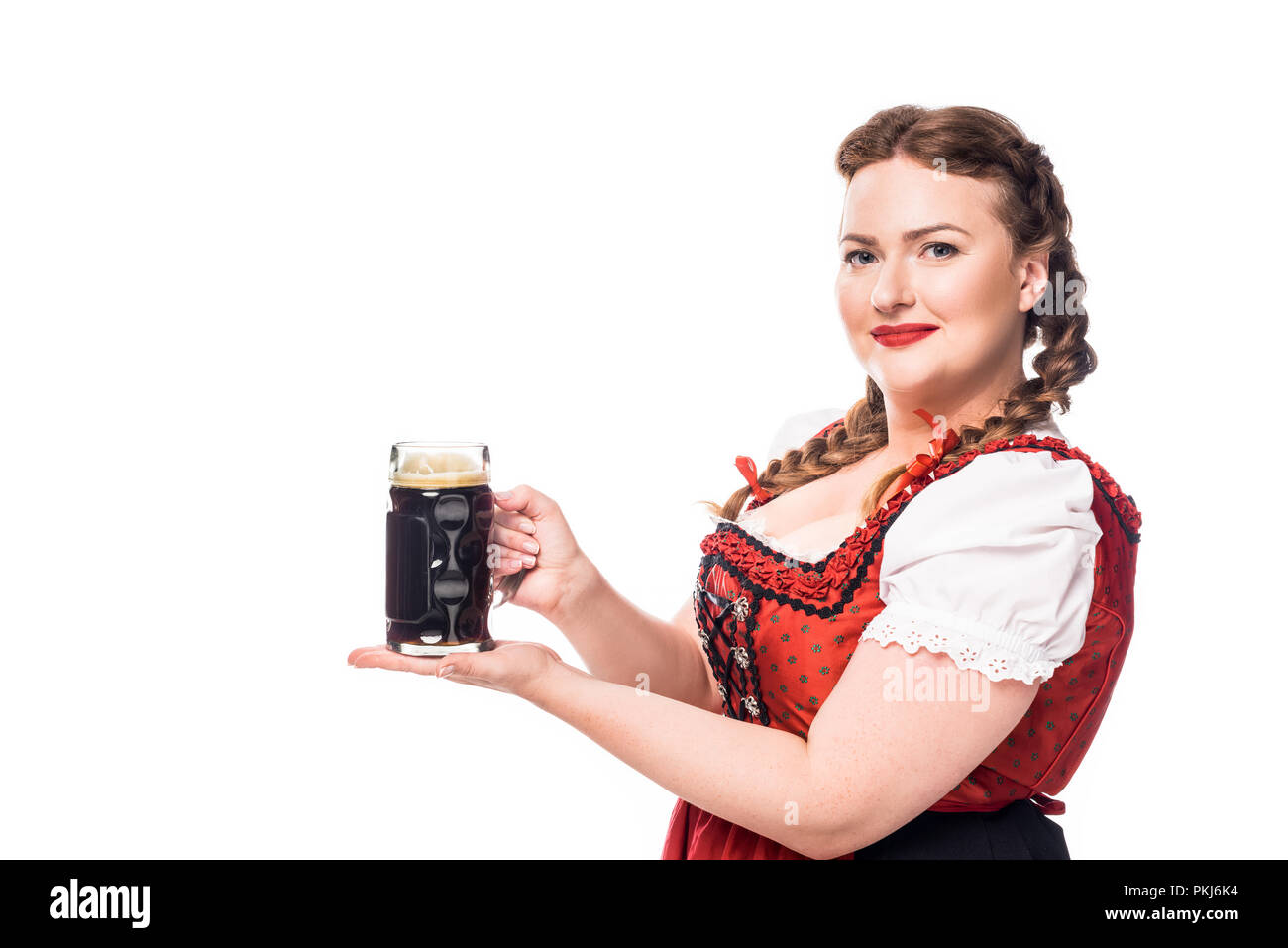 Happy Oktoberfest Waitress In Traditional Bavarian Dress Holding Mug Of