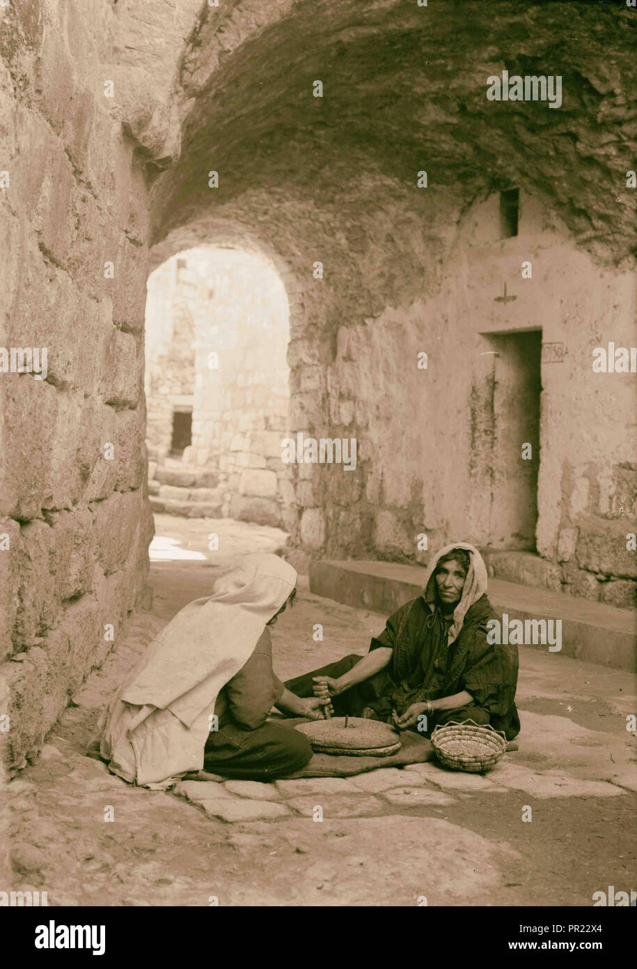 Women Of Bethlehem Grinding In Courtyard Before Their Home West