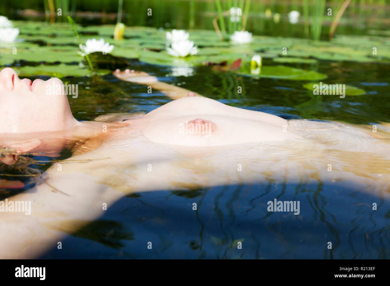 Naked Girl In A Lake With Water Lily Stock Photo Alamy