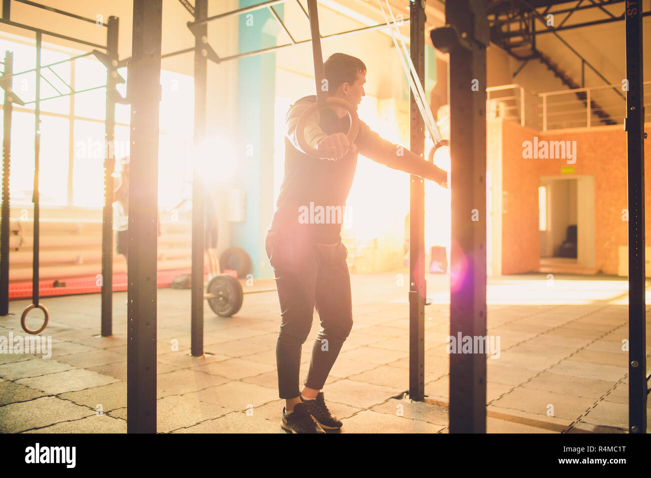 Muscle Up Exercise Athletic Man Doing Intense Workout At The Gym On