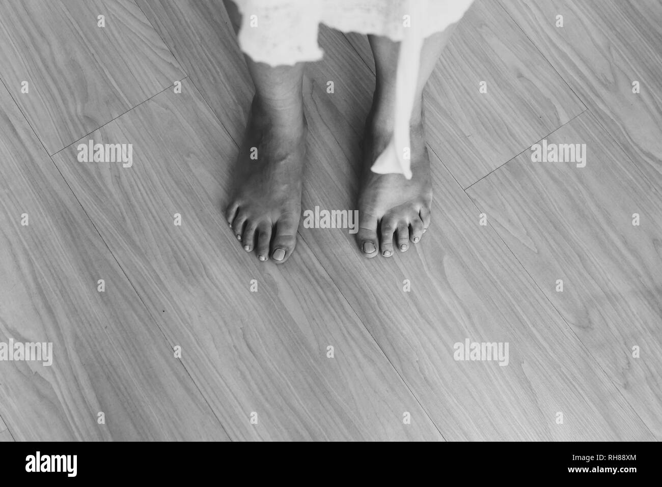 Black And White From Above Crop Barefoot Legs Of Lady In White Wear