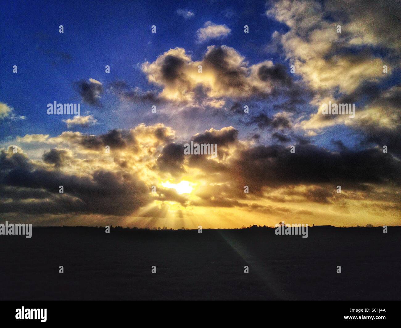 dramatic-sky-shafts-if-sunlight-behind-c