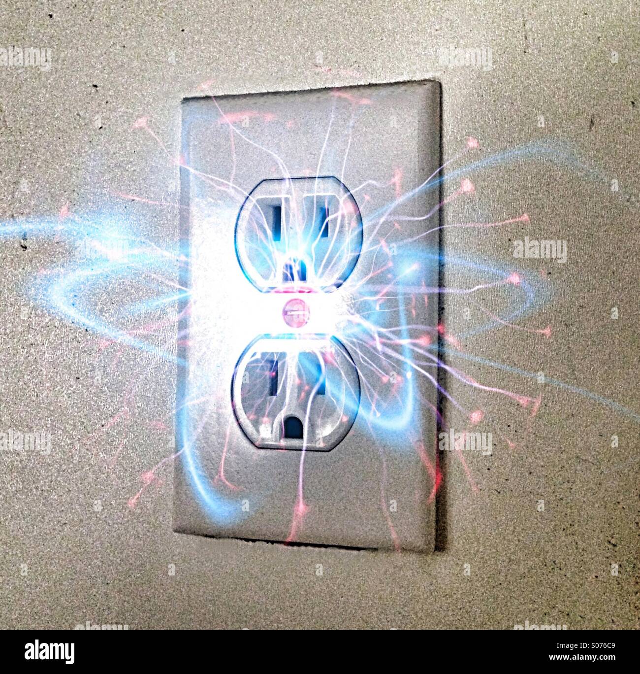 Electricity Sparks From Wall Outlet Stock Photo, Royalty Free Image