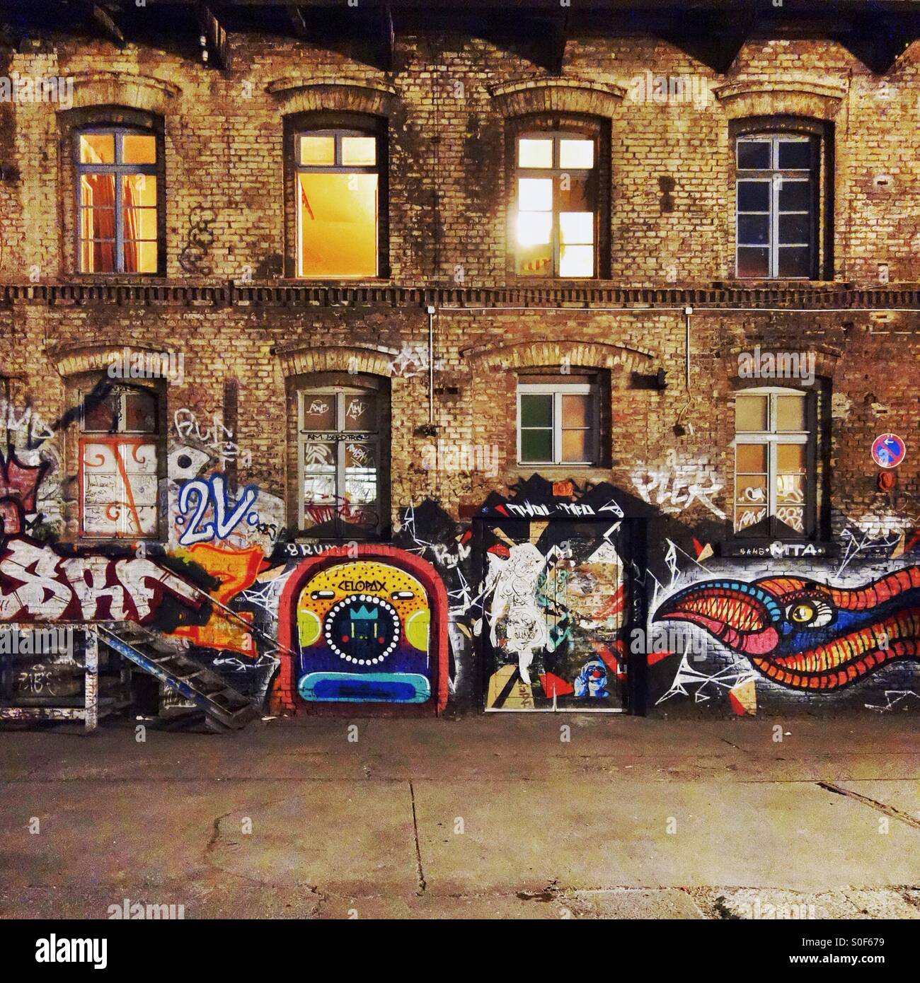 Old building with graffiti at night in Berlin Stock Photo, Royalty Free