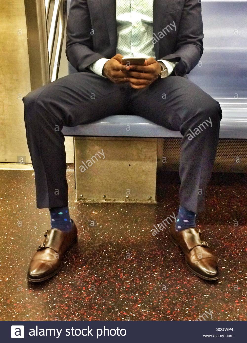 stylish-man-sitting-on-the-subway-with-a