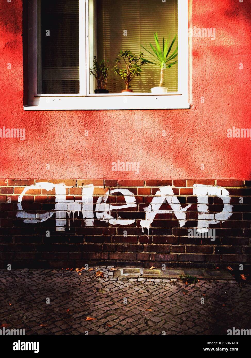 Cheap graffiti on a house in the neighbourhood schillerkiez in neukoelln berlin germany