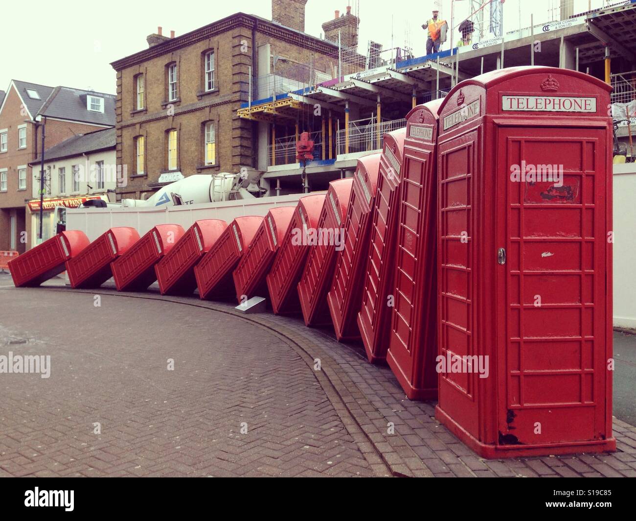 Toppled telephone boxes in Old London Road, Kingston upon Thames Stock