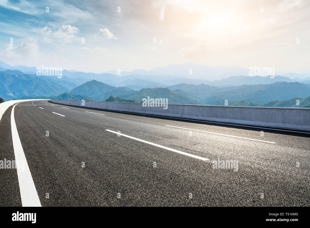 Empty Asphalt Road And Mountains With Beautiful Clouds Landscape Stock