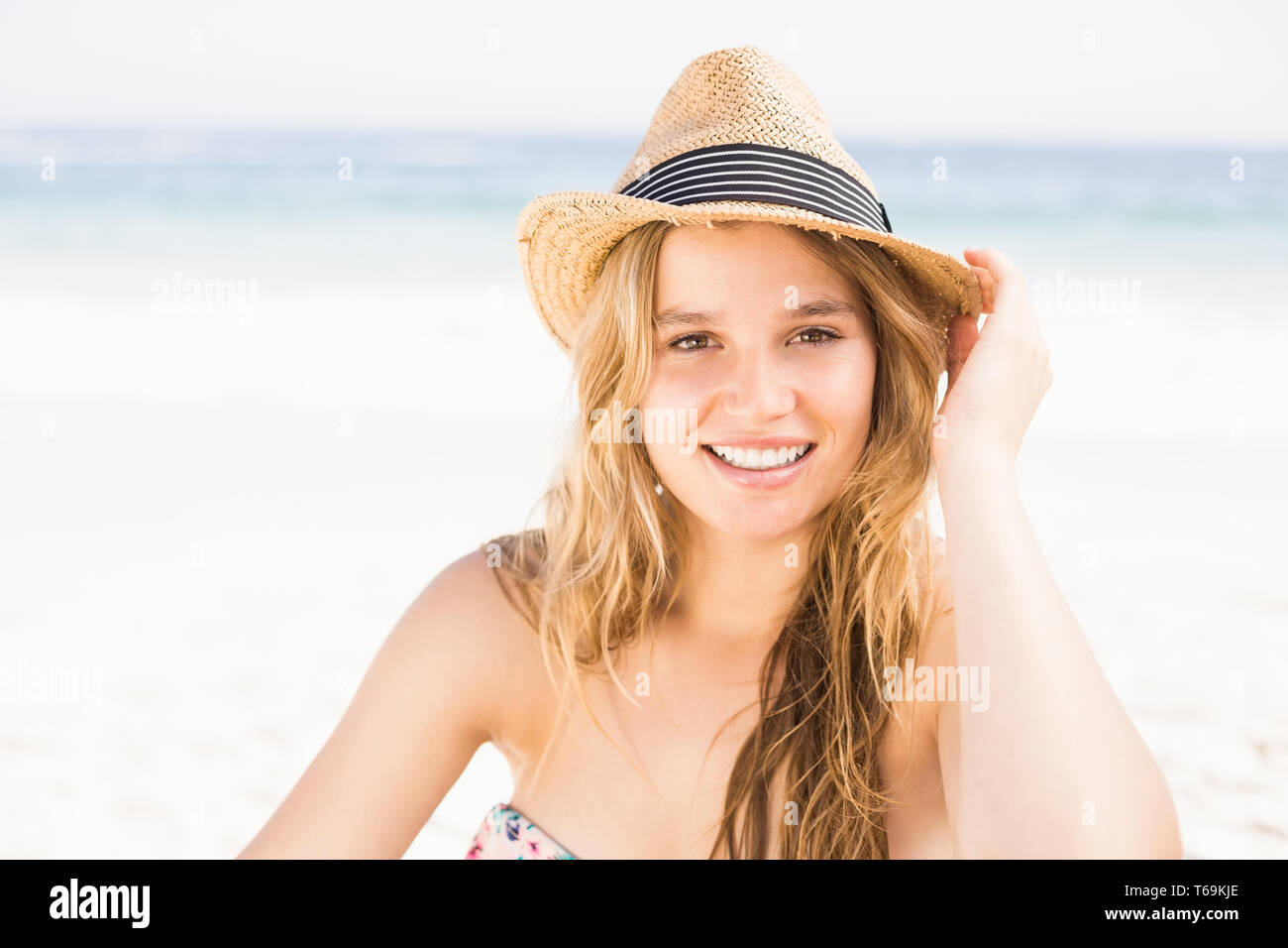 Blonde Woman In Bikini Sitting On Beach Hi Res Stock Photography And