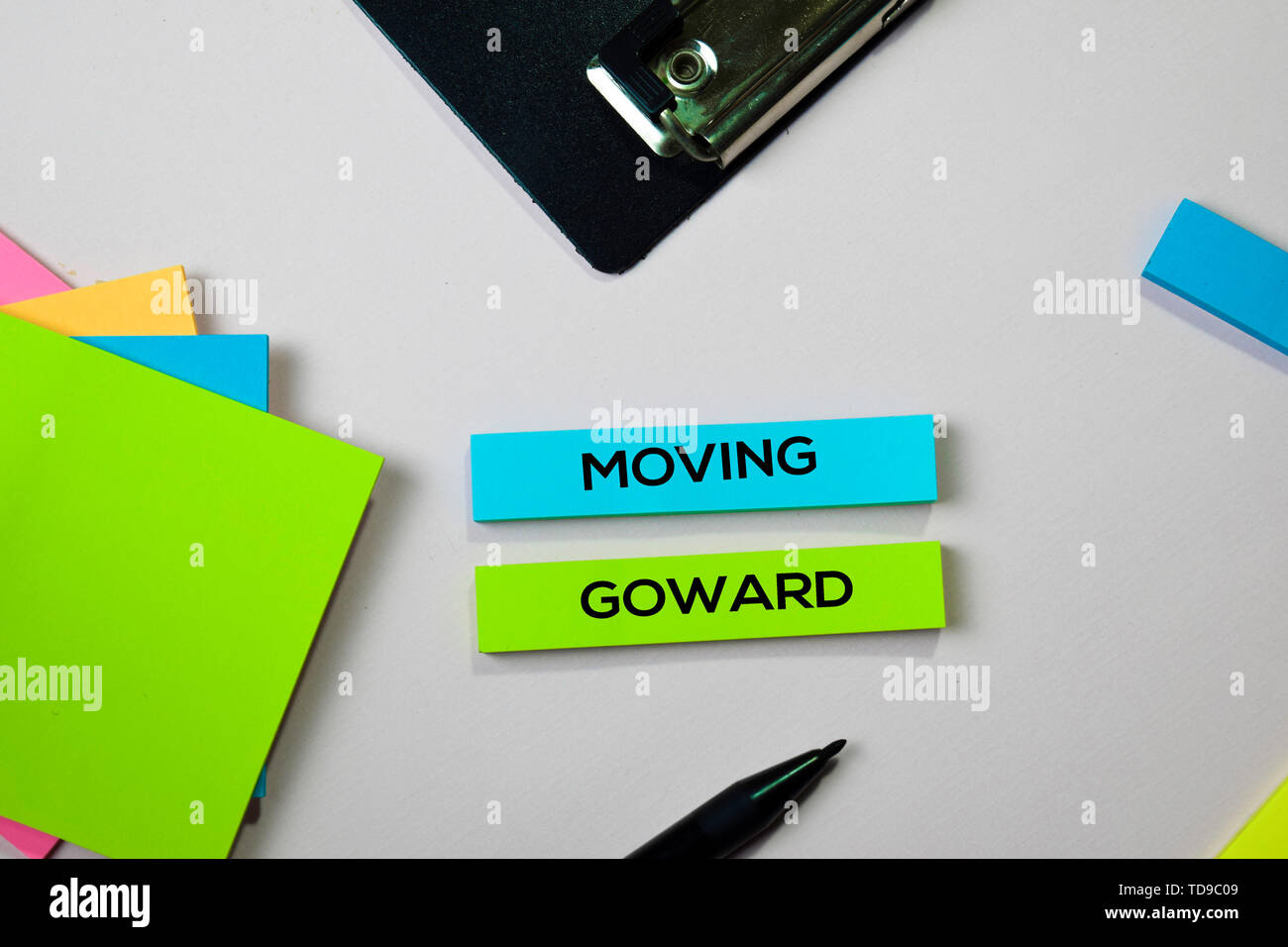 Moving Goward Text On Sticky Notes With Office Desk Concept Stock Photo