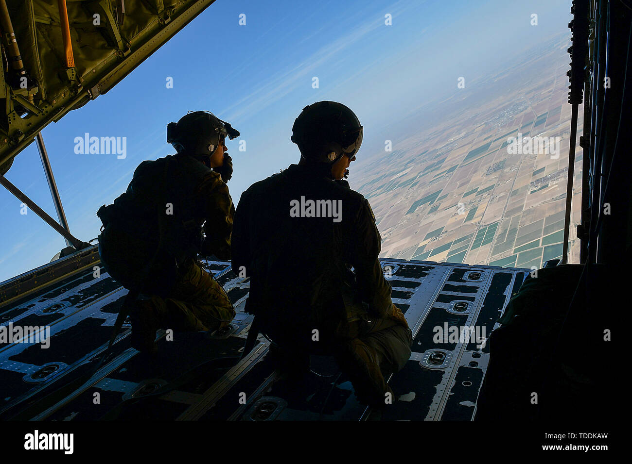 U S Airmen From The Th Rescue Squadron Look Out The Back Of An Hc