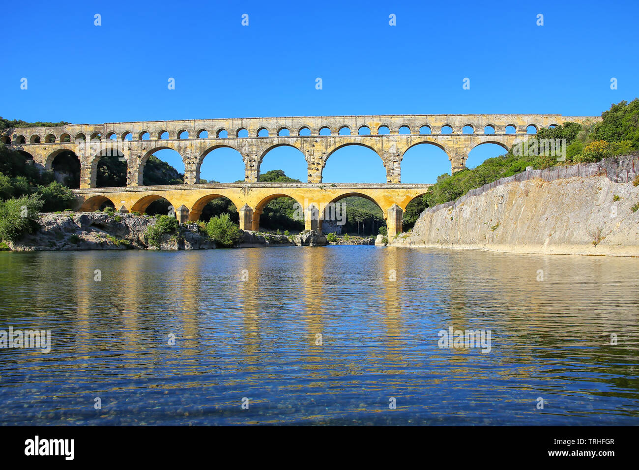 Aqueduct Pont Du Gard Reflected In Gardon River Southern France It Is