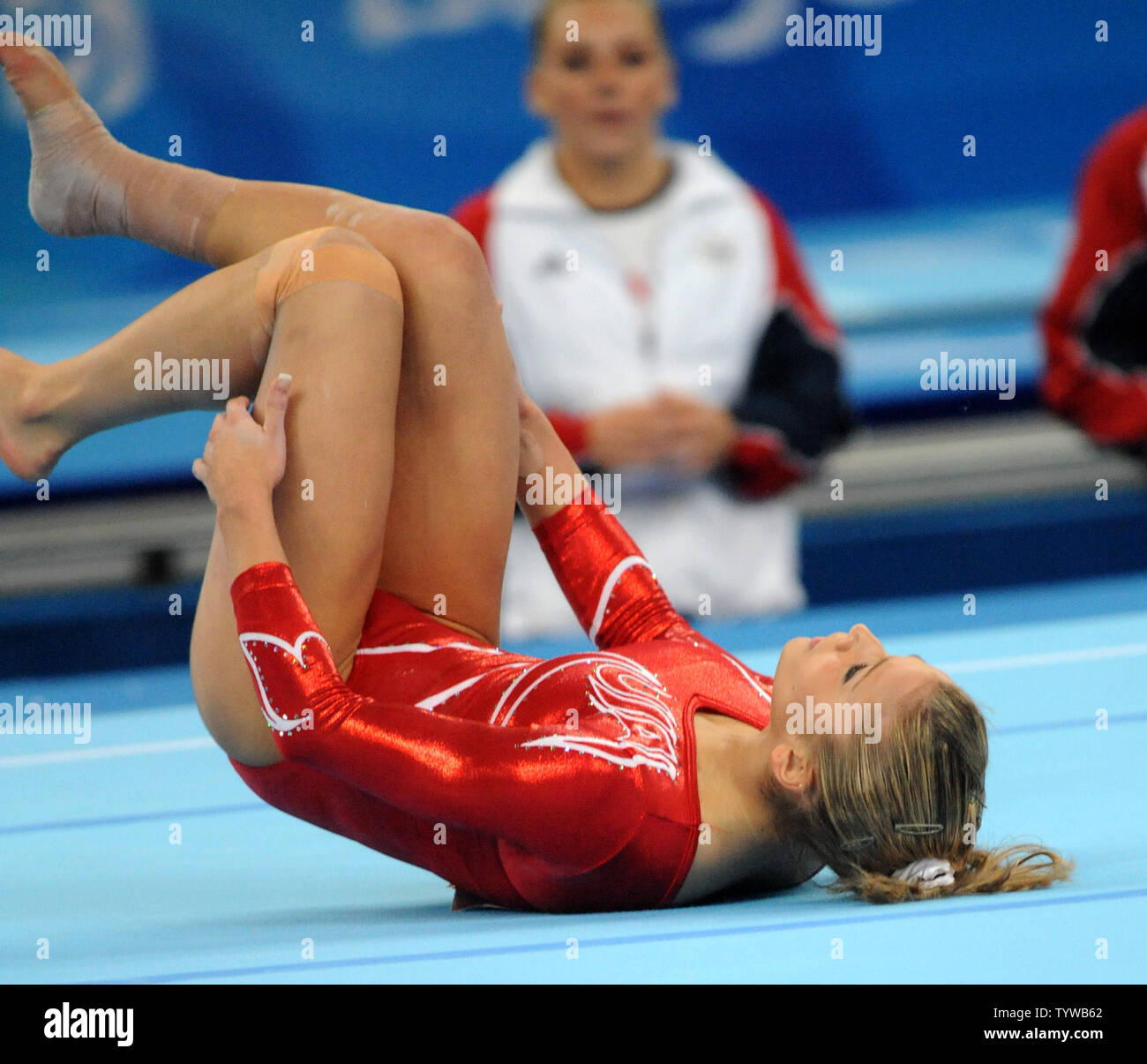 Usa S Alicia Sacramone Lies On Her Back As She Slips And Falls During
