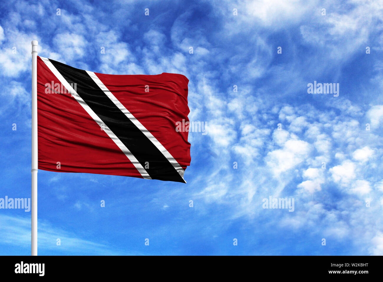 National Flag Of Trinidad And Tobago On A Flagpole In Front Of Blue Sky